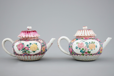 A pair of Chinese famille rose teapots on stand, Yongzheng/Qianlong, 18th C.